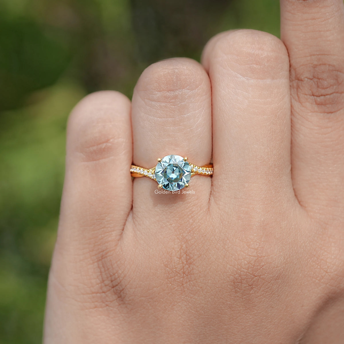In finger view of Round Cut Moissanite Engagement Ring