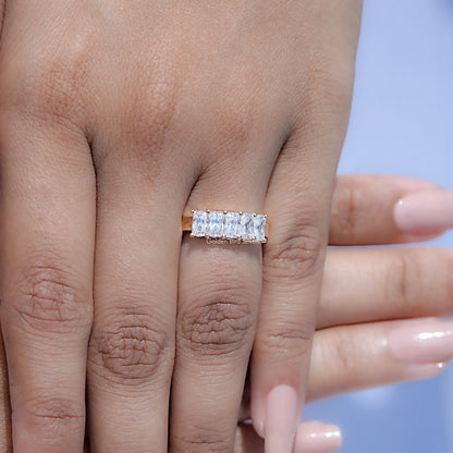Five-stone moissanite radiant-cut band ring with square-cut stones, side view on hand