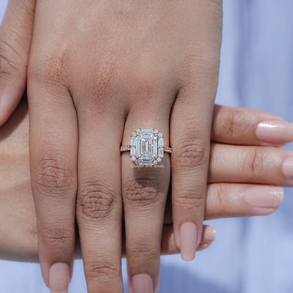 Emerald-cut halo moissanite engagement ring on hand with wide split band