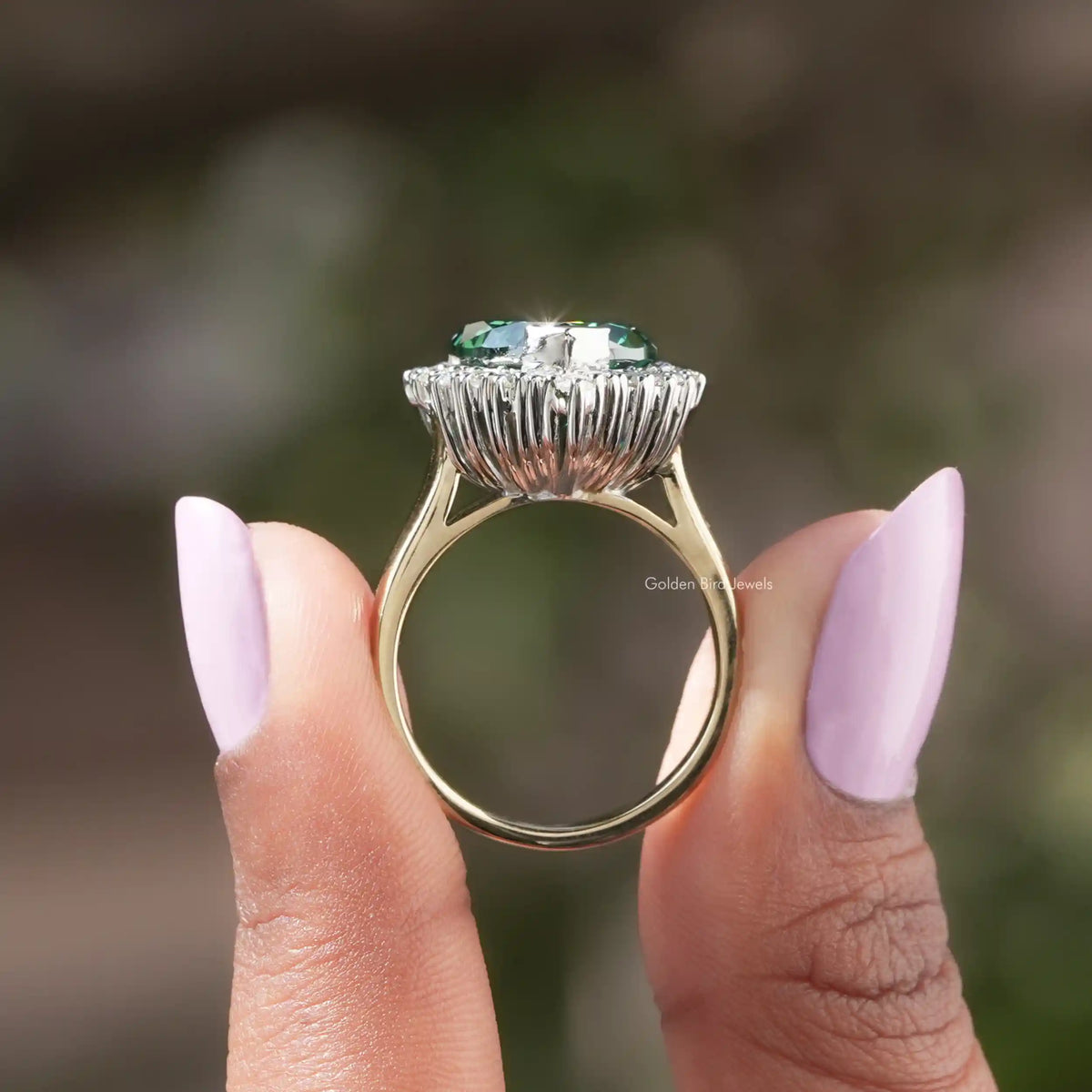 Back View of Green Moissanite Heart Cut Halo Engagement Ring In two fingers