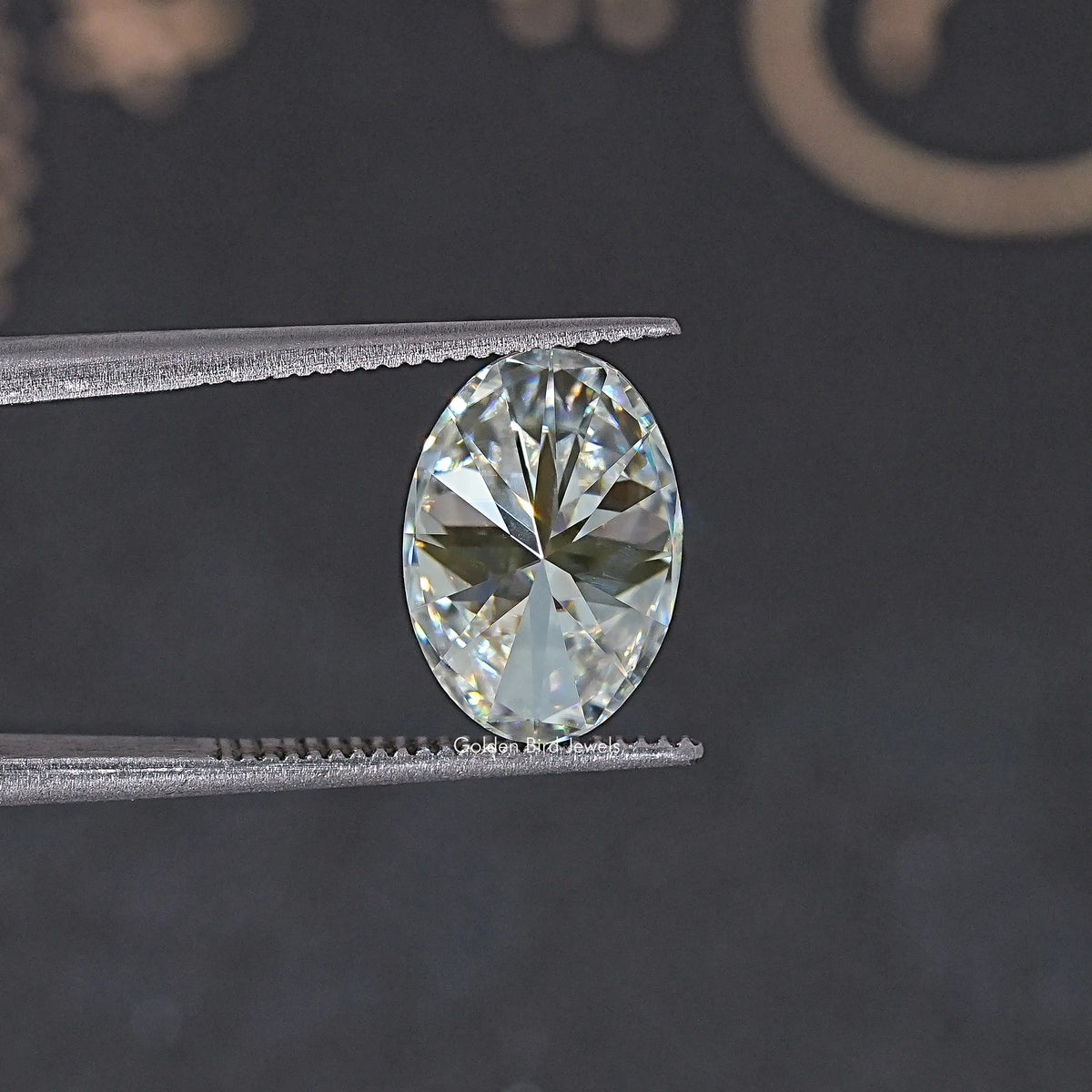 Oval-cut moissanite loose stone, front view with crisp faceted brilliance