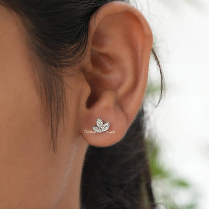 In ear View of colorless marquise cut leaf stud earrings in  colorless moissanite