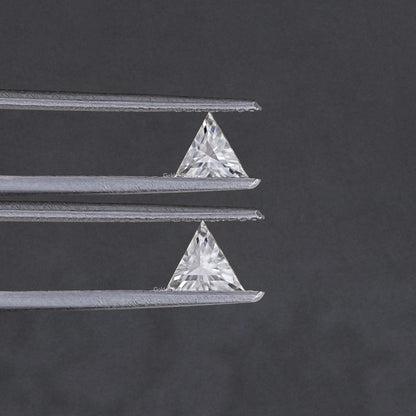 Triangle-cut clear moissanite stones, matching pair on silver tweezers