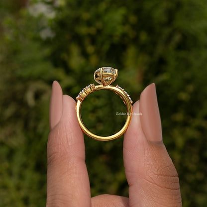 Gold-tone infinity ring band with oval old mine center stone and prong-set accents