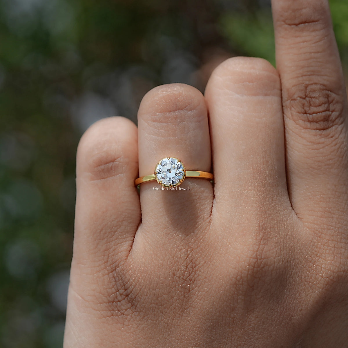 In finger view of European Cut Moissanite Solitaire Ring