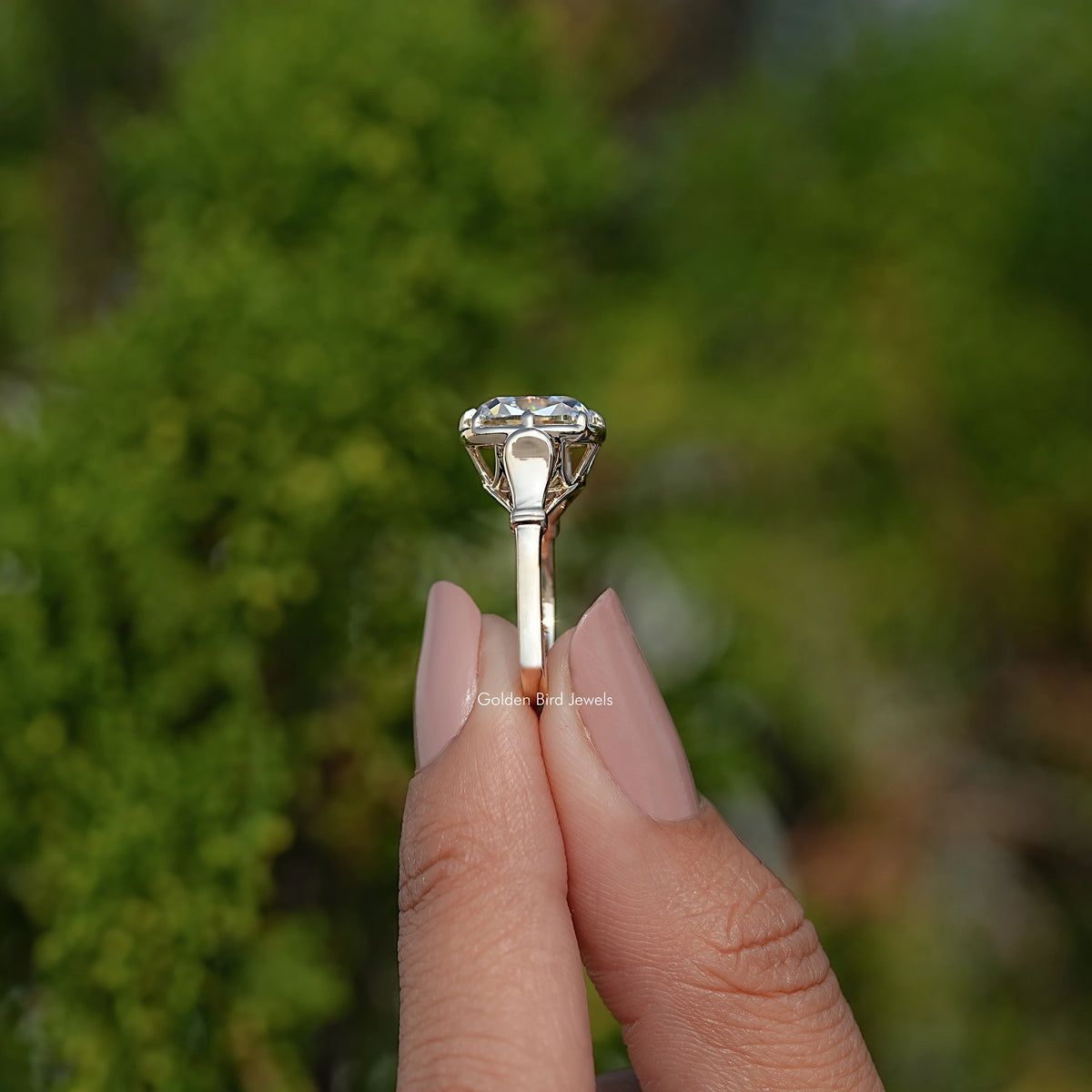 Gold cushion-cut moissanite solitaire ring with prong setting