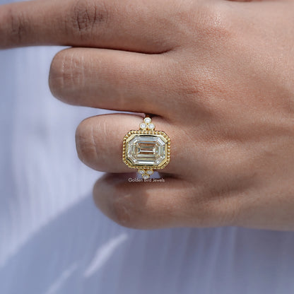 Close View Of Bezel Set Emerald Cut Ring