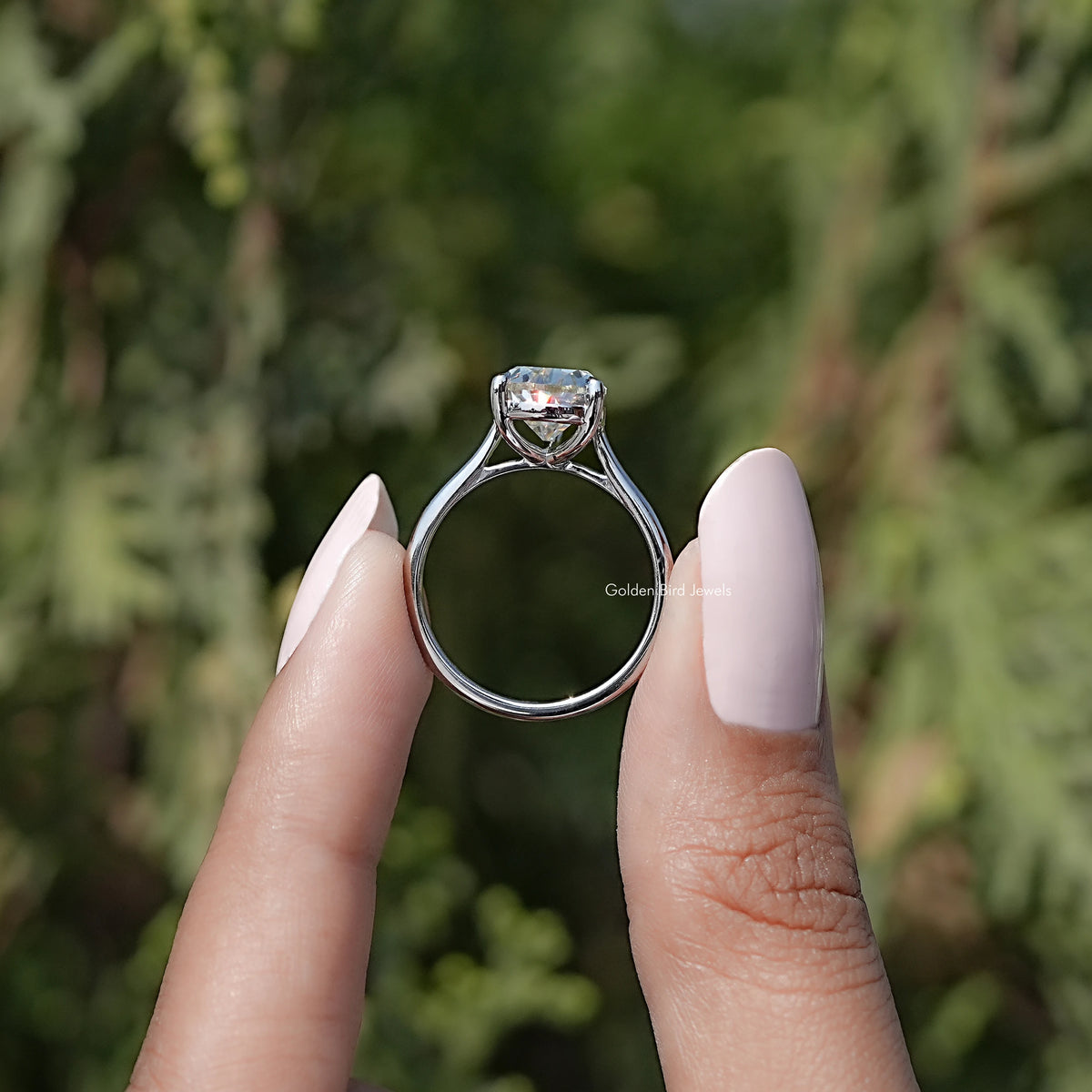 Back view of Old Mine Pear Moissanite Solitaire Ring in secure setting 