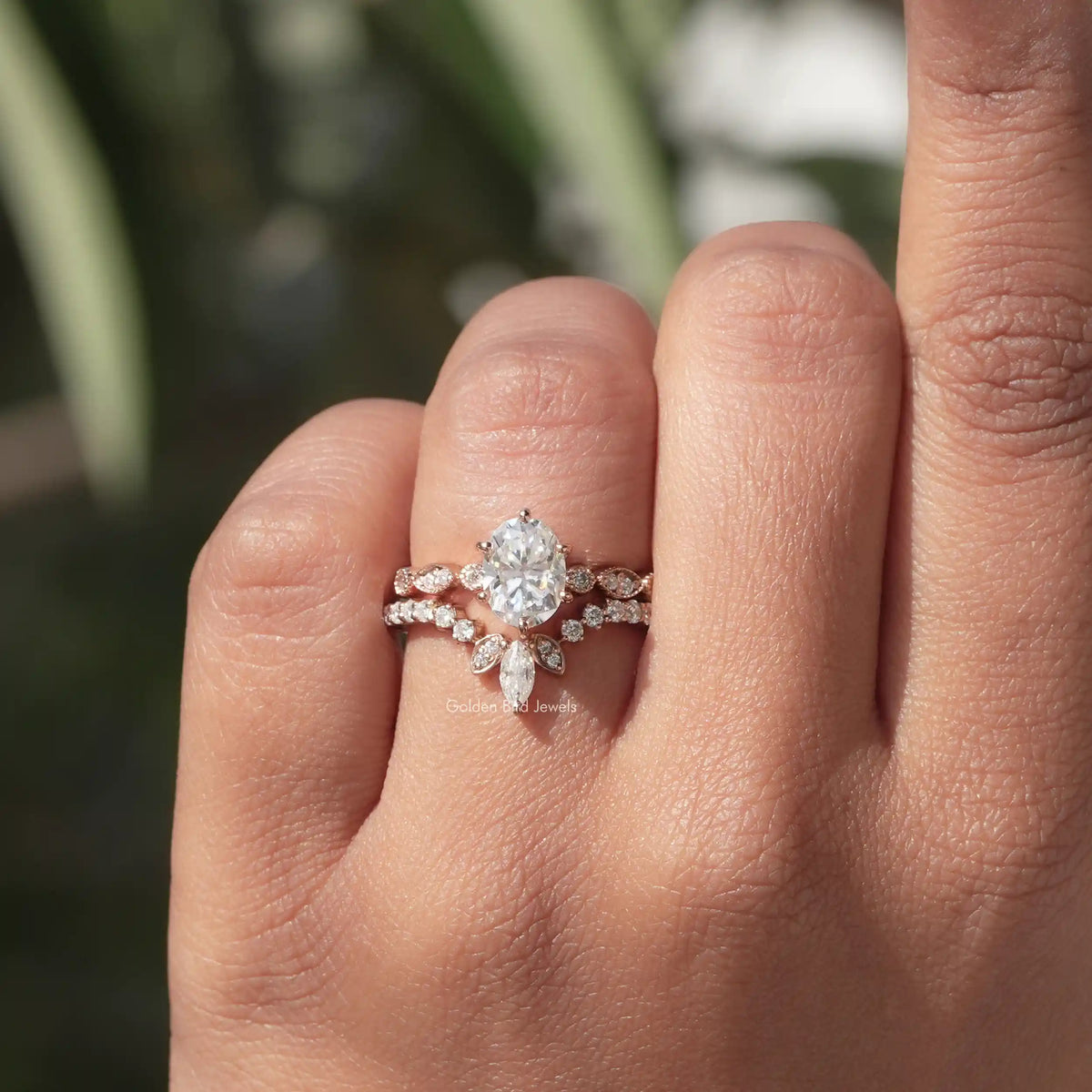 Moissanite Oval Cut Ring With Chevron Band In Yellow Gold