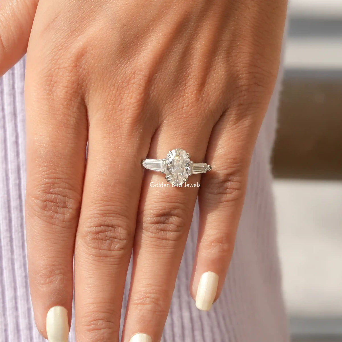 View of Moissanite Oval Cut Three Stone Ring In finger