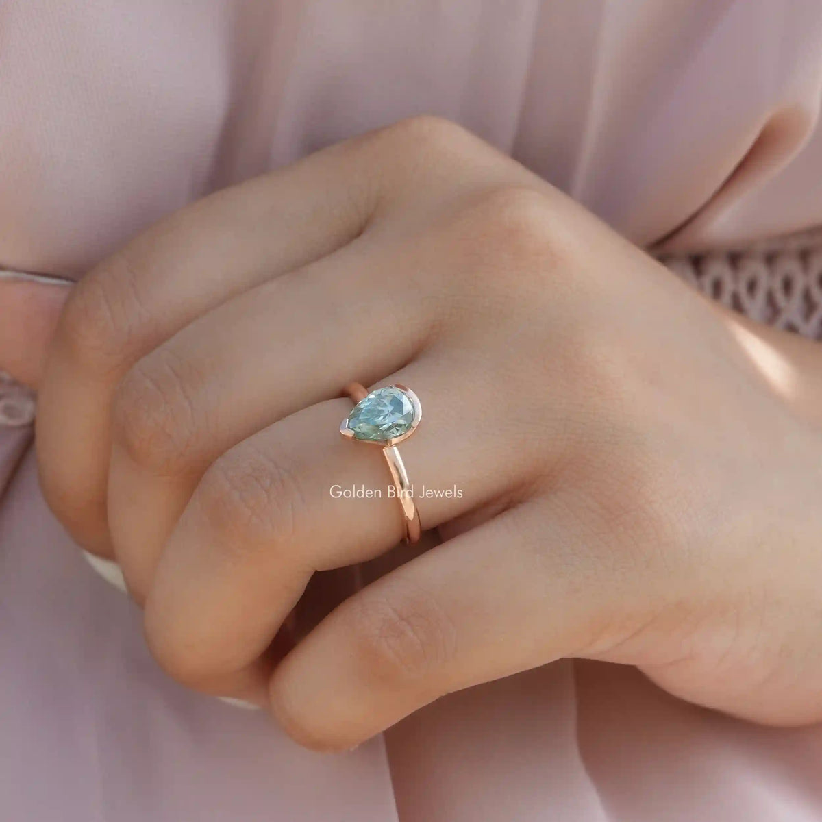 View of Pear Cut Moissanite Solitaire Engagement Ring In Finger