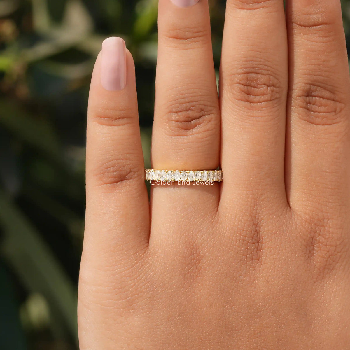 Moissanite stacking band with prong-set stones, half-eternity design