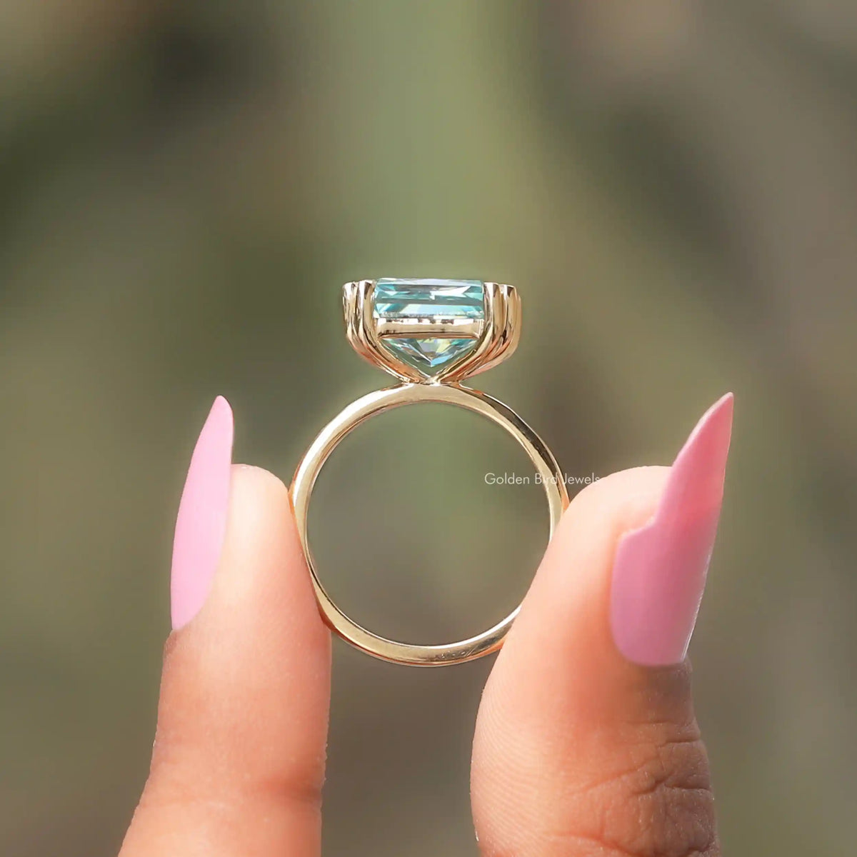 Back View of Radiant Cut Solitaire Ring In two fingers