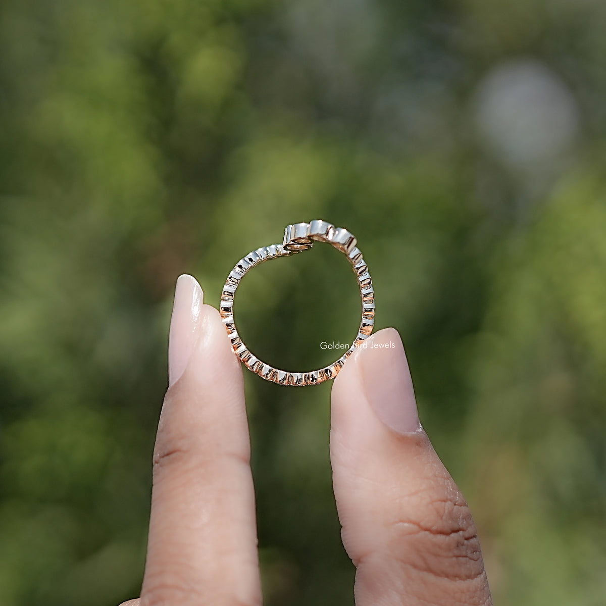 Back view of Round Cut Moissanite Solitaire Ring in secure setting 