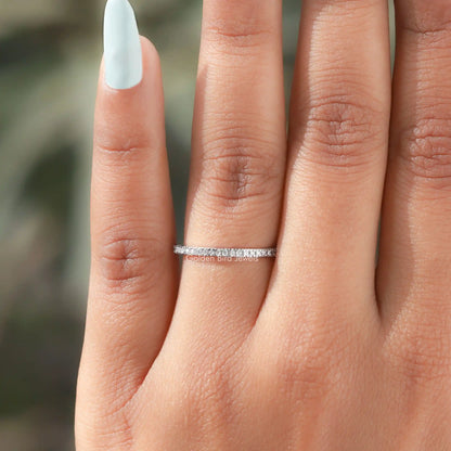 925 sterling silver eternity band ring on fingers, close side view, round moissanite stones