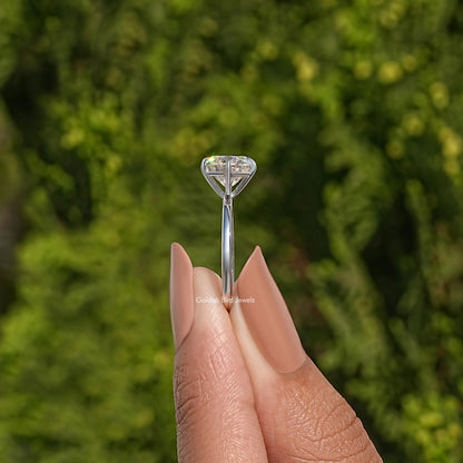 Round-cut moissanite solitaire bridal ring, sterling silver prongs and slim band