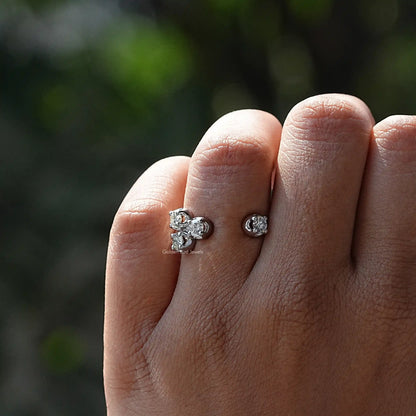 Open cuff wedding ring with round moissanite cluster, silver-tone metal on hand