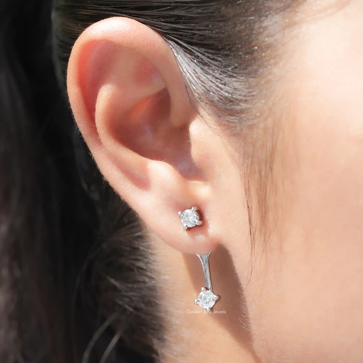 Silver-tone round stud and matching drop earrings with screw-back closure, side view