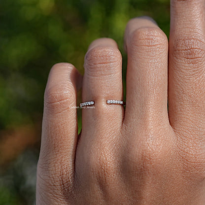 Round moissanite open cuff band ring on a hand