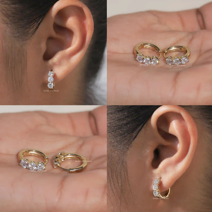Small huggie hoop earrings with round-cut stones, shown from multiple angles on ear and hand
