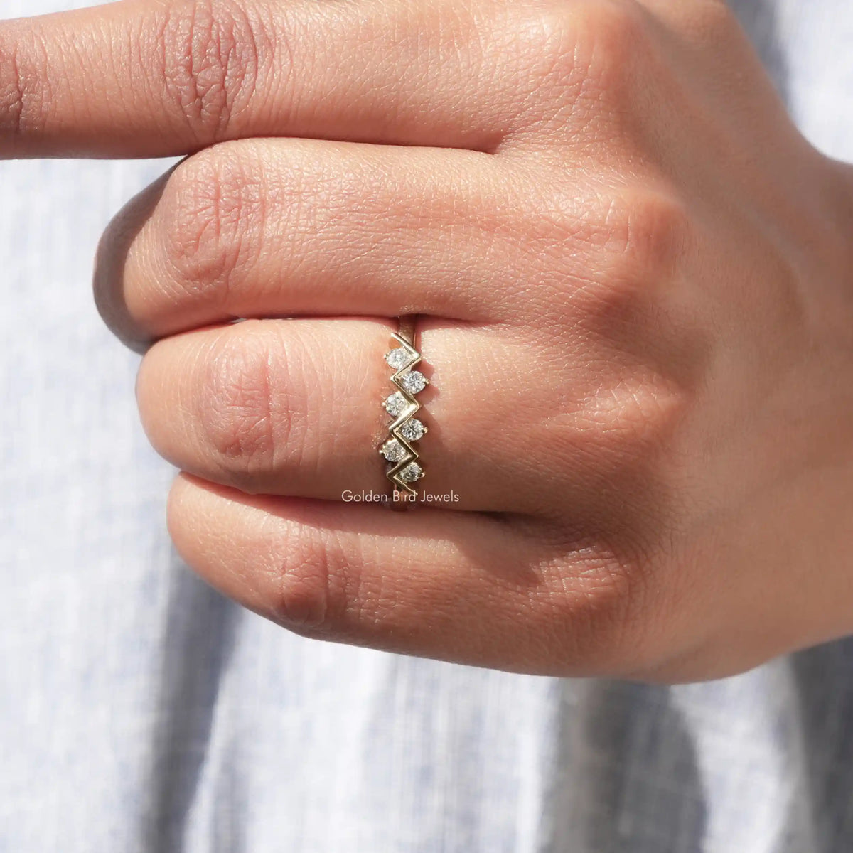 Silver-tone round eternity band ring with evenly spaced round prong-set stones