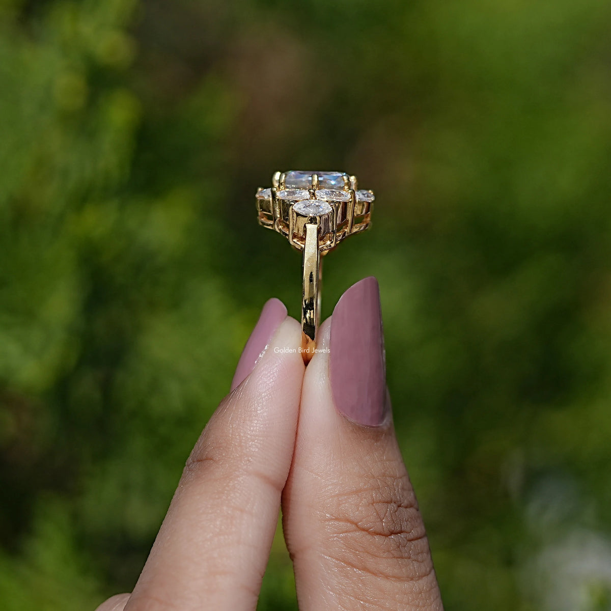 14K yellow gold side profile engagement ring with prong-set step-cut center
