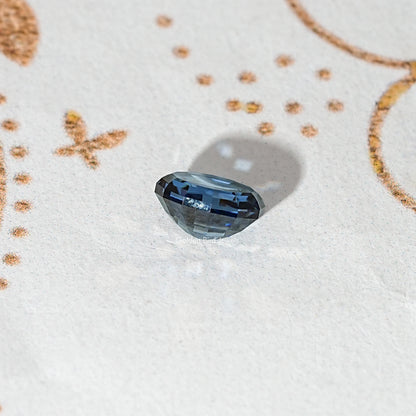Loose step-cut oval blue moissanite gemstone with crisp geometric facets