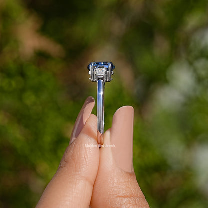 Silver ring profile with blue oval gemstone in prong setting, slim band