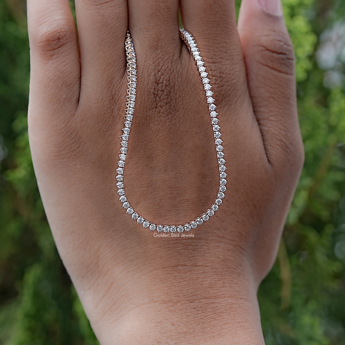 Round Cut Moissanite Tennis Necklace Displayed in Hand