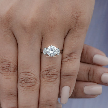 View of Round And Oval Cut Moissanite Engagement Ring in prongs setting