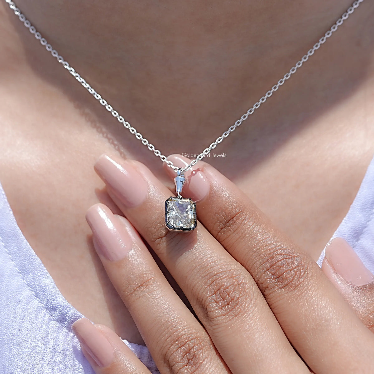 Square-cut moissanite solitaire pendant on silver chain