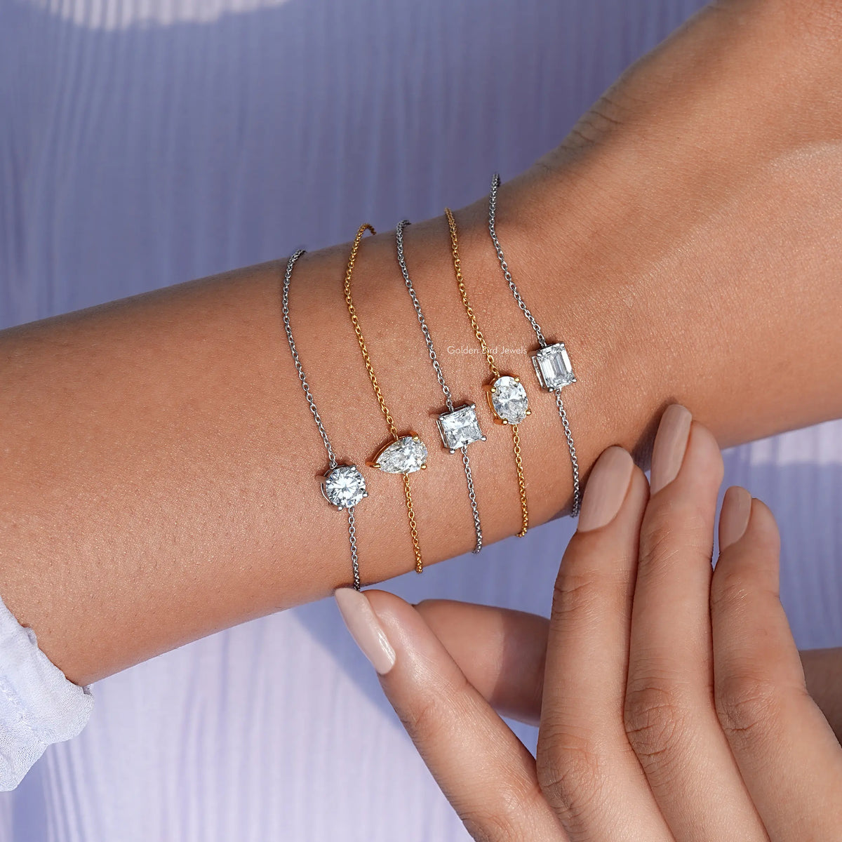 Interlaced bracelets in silver and gold-tone chains with round and square moissanite