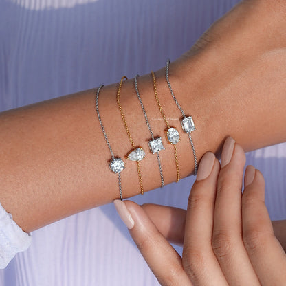 Interlaced bracelets in silver and gold-tone chains with round and square moissanite