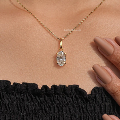Oval-cut bezel stud pendant with near-white stone on a thin gold chain