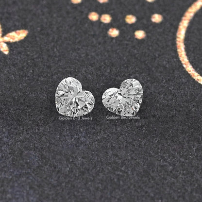 Heart-cut loose diamond pair, two clear heart stones side by side