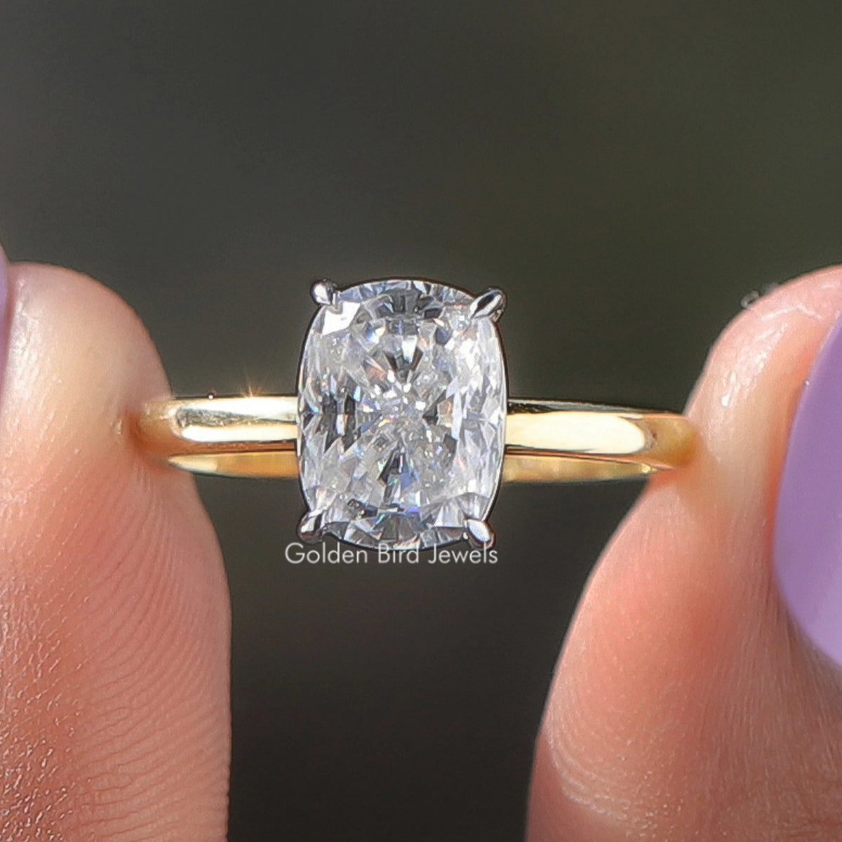 Yellow gold solitaire ring with elongated cushion-cut lab diamond and 4-prong setting