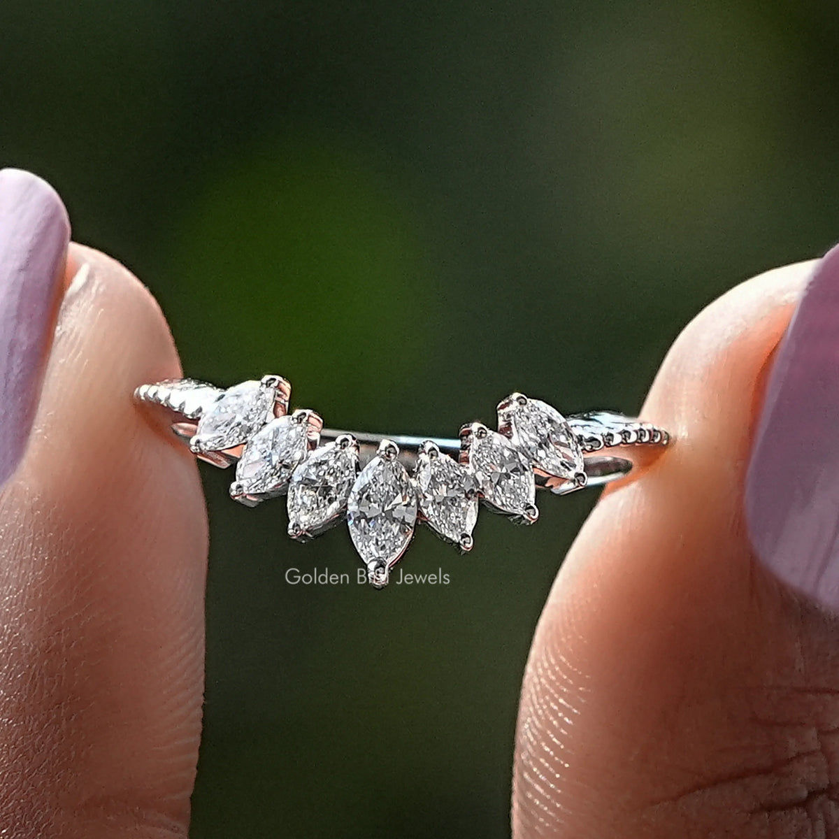 Marquise Cut Curved Stackable Diamond Band Held Between Fingers