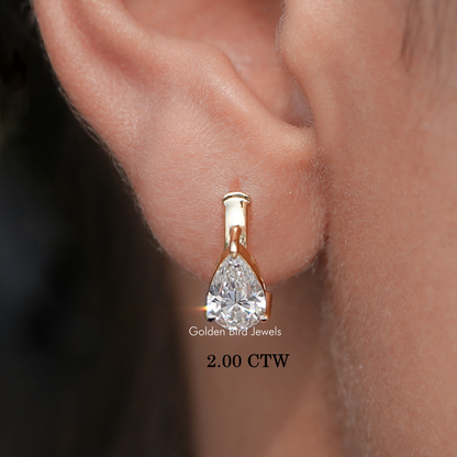 Gold huggie hoop earrings with pear-cut lab diamonds, 2.00 CTW close-up