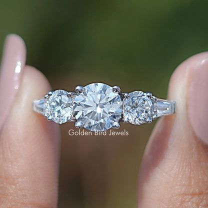 Five-stone 14K white gold diamond ring close-up with baguette-cut center stone