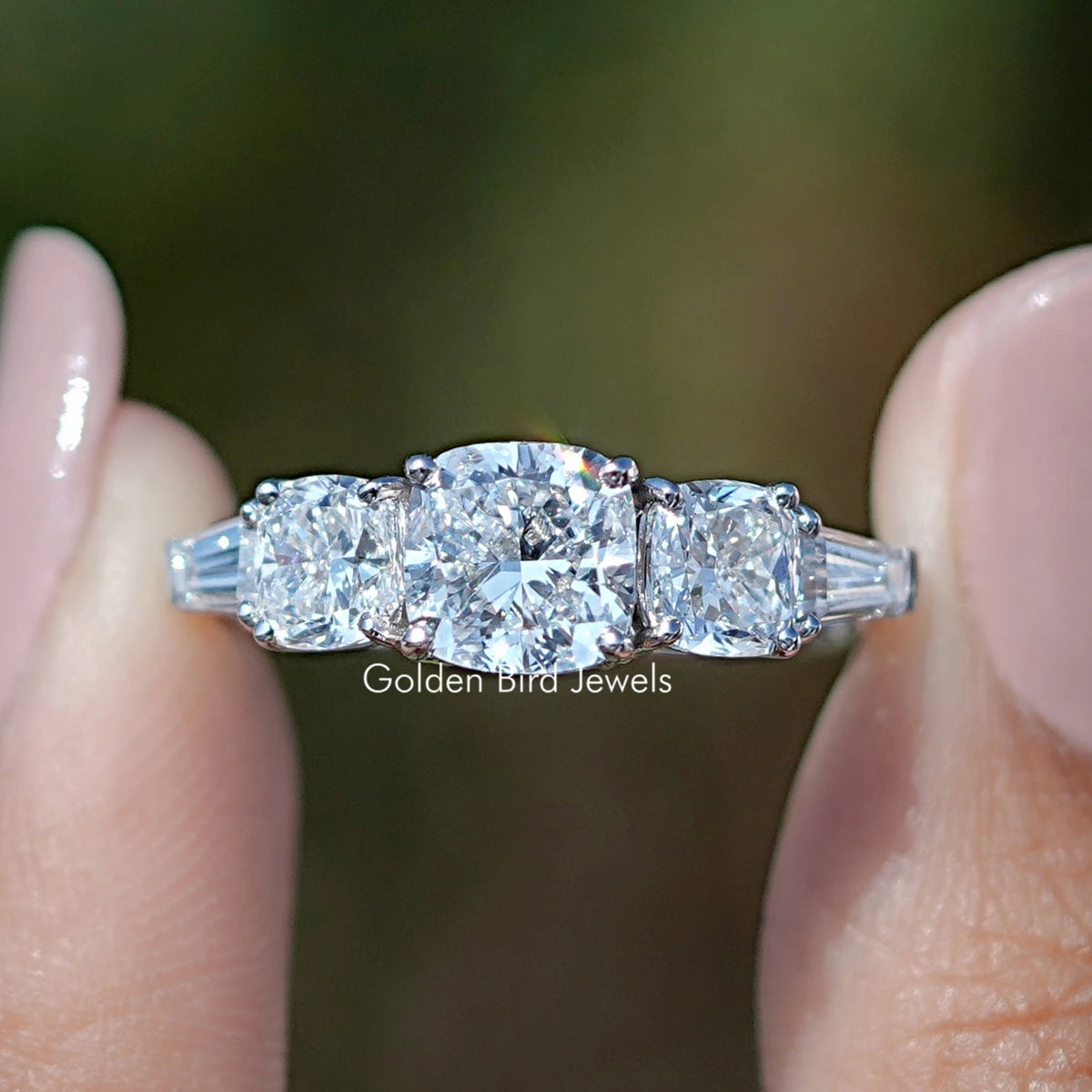 Five-stone lab diamond ring with central square stone and baguette accents, white gold band