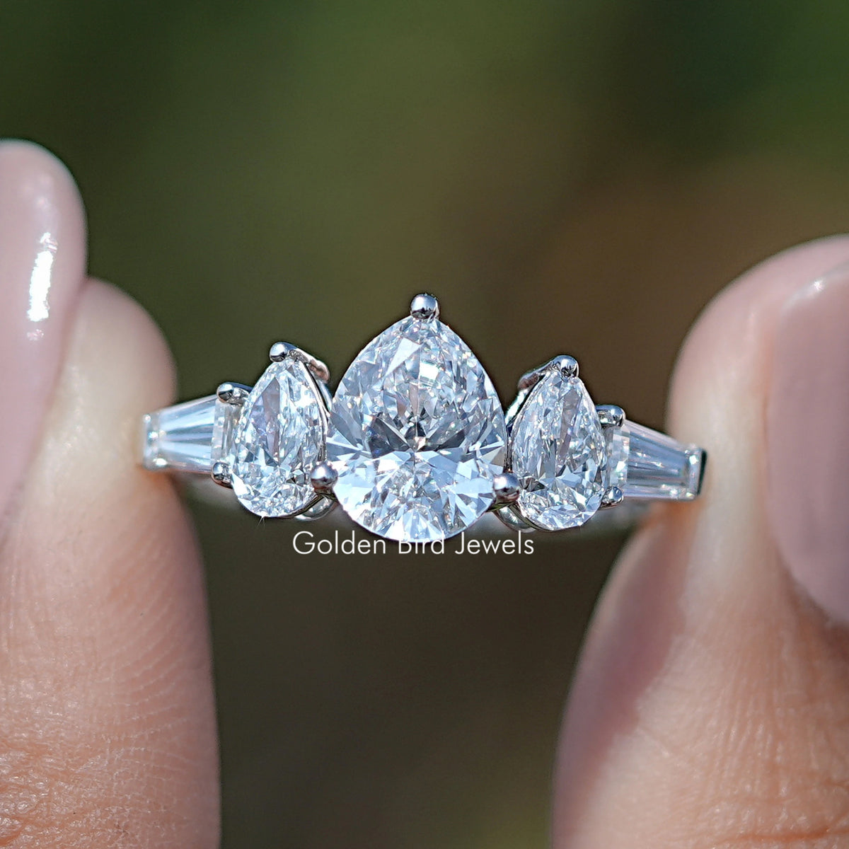 14K white gold five-stone pear-cut diamond ring with sparkling central pear