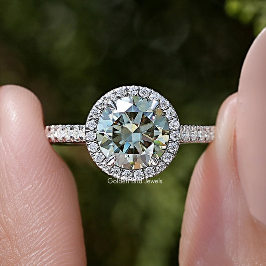 Round-cut moissanite accent ring in silver with pavé halo and slim band
