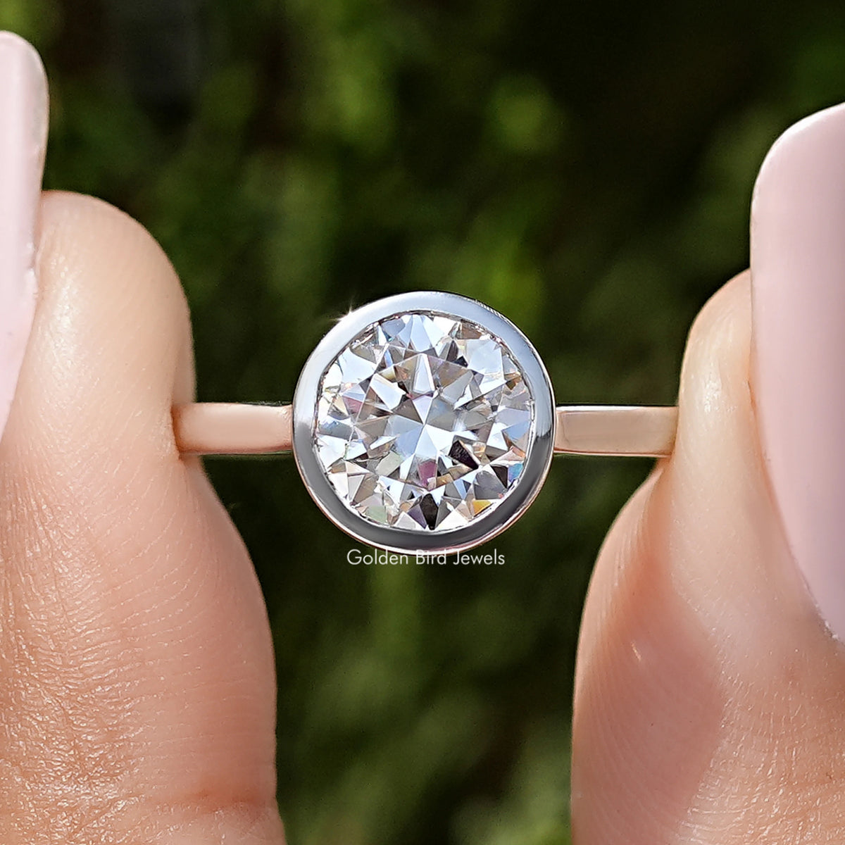 Sterling silver round moissanite bezel wedding ring, close-up of round center stone