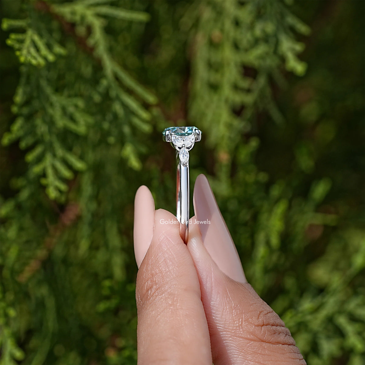 Sterling silver moissanite engagement ring with round center stone and halo prongs
