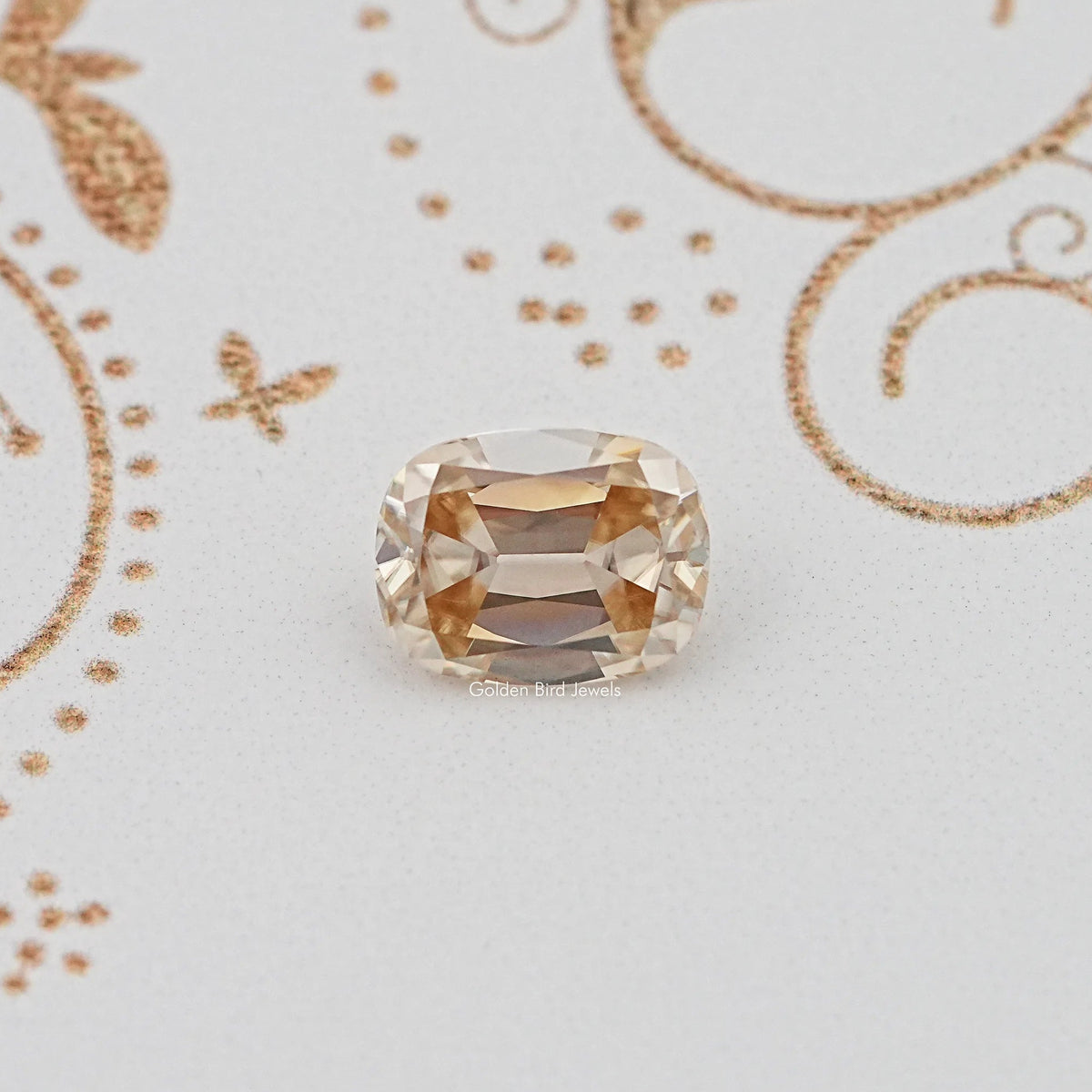 Golden yellow cushion-cut loose gemstone with faceted oval shape