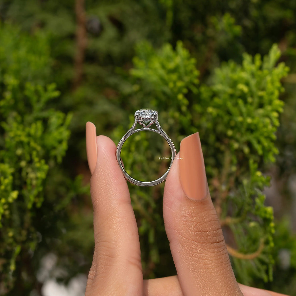 Cushion-cut diamond split-shank ring viewed from side, prong setting