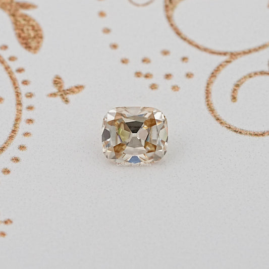 Cushion-cut faceted loose gemstone with light yellow/clear tones
