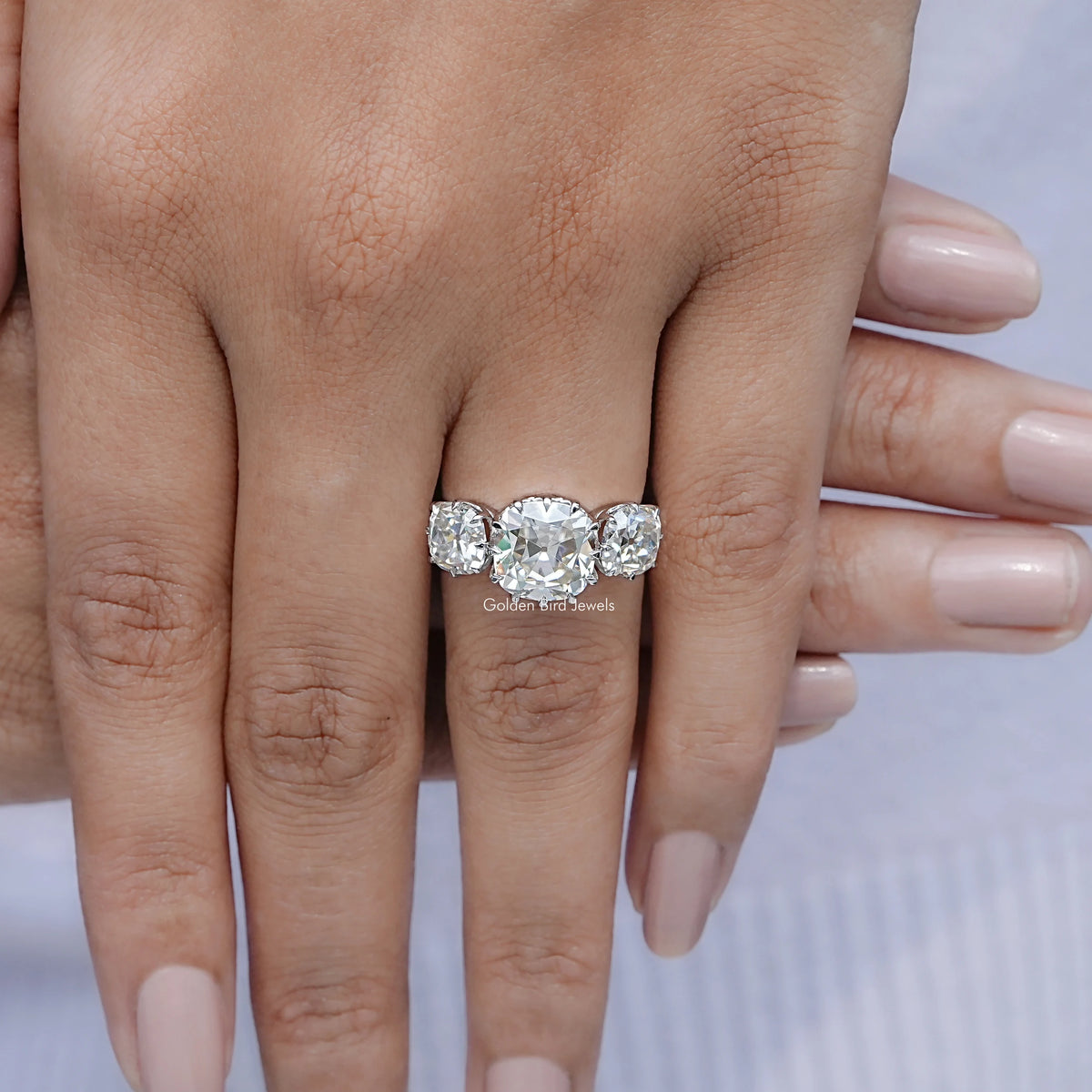 Top view of Old Mine Cushion Three Stone Moissanite Ring for women 's wear