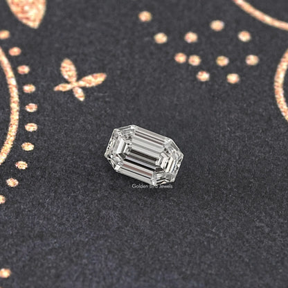 Emerald-cut lab-grown diamond with clear step facets, face-up view