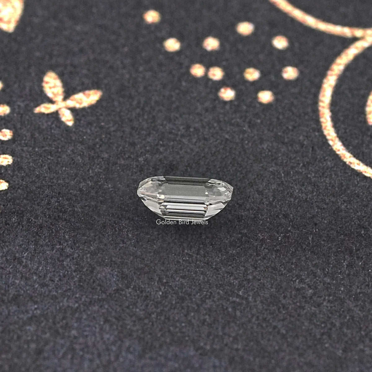 Emerald-cut lab-grown diamond with step facets, face-up close view